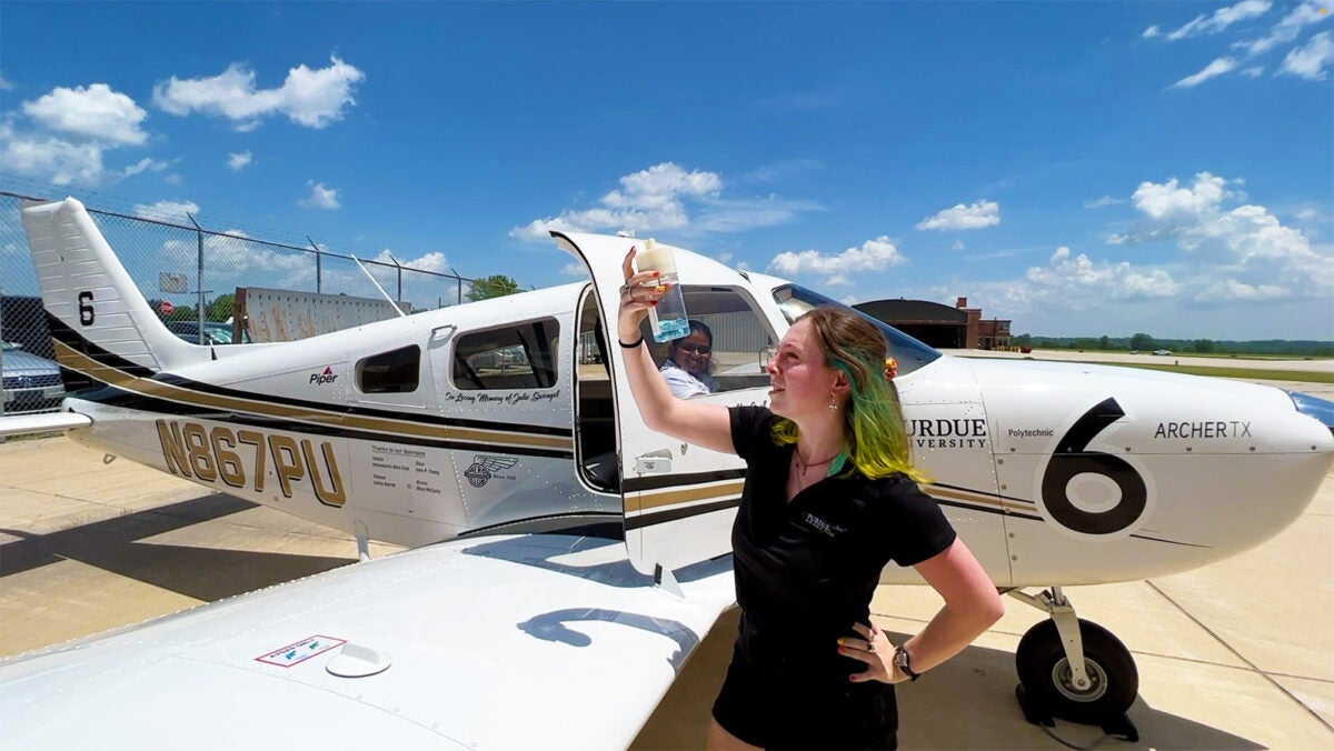Alex Small, a senior at Purdue University, performs a preflight fuel check for the aircraft her team used for the 2022 Air Race Classic. [Credit: John O’Malley/Purdue University]