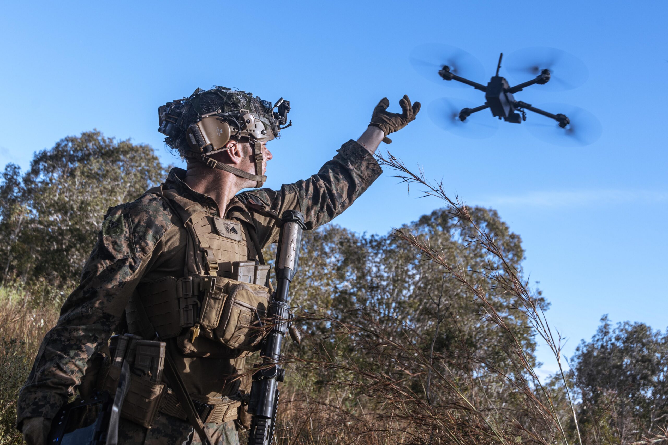 U.S. military personnel deploys a small UAS drone