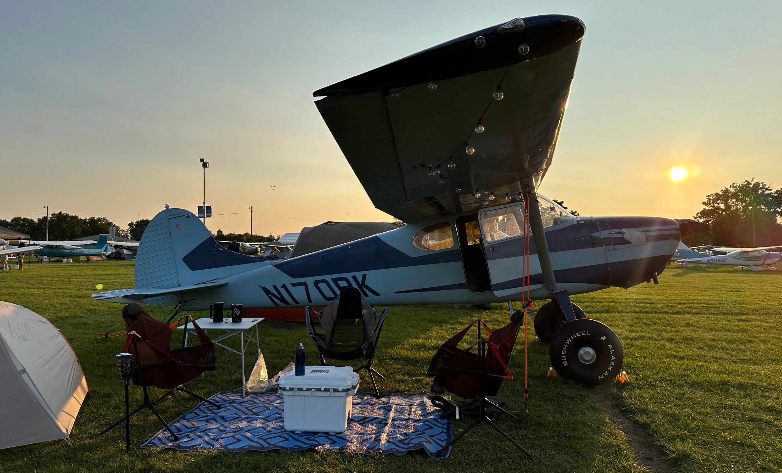 Pelican cooler in front of a plane