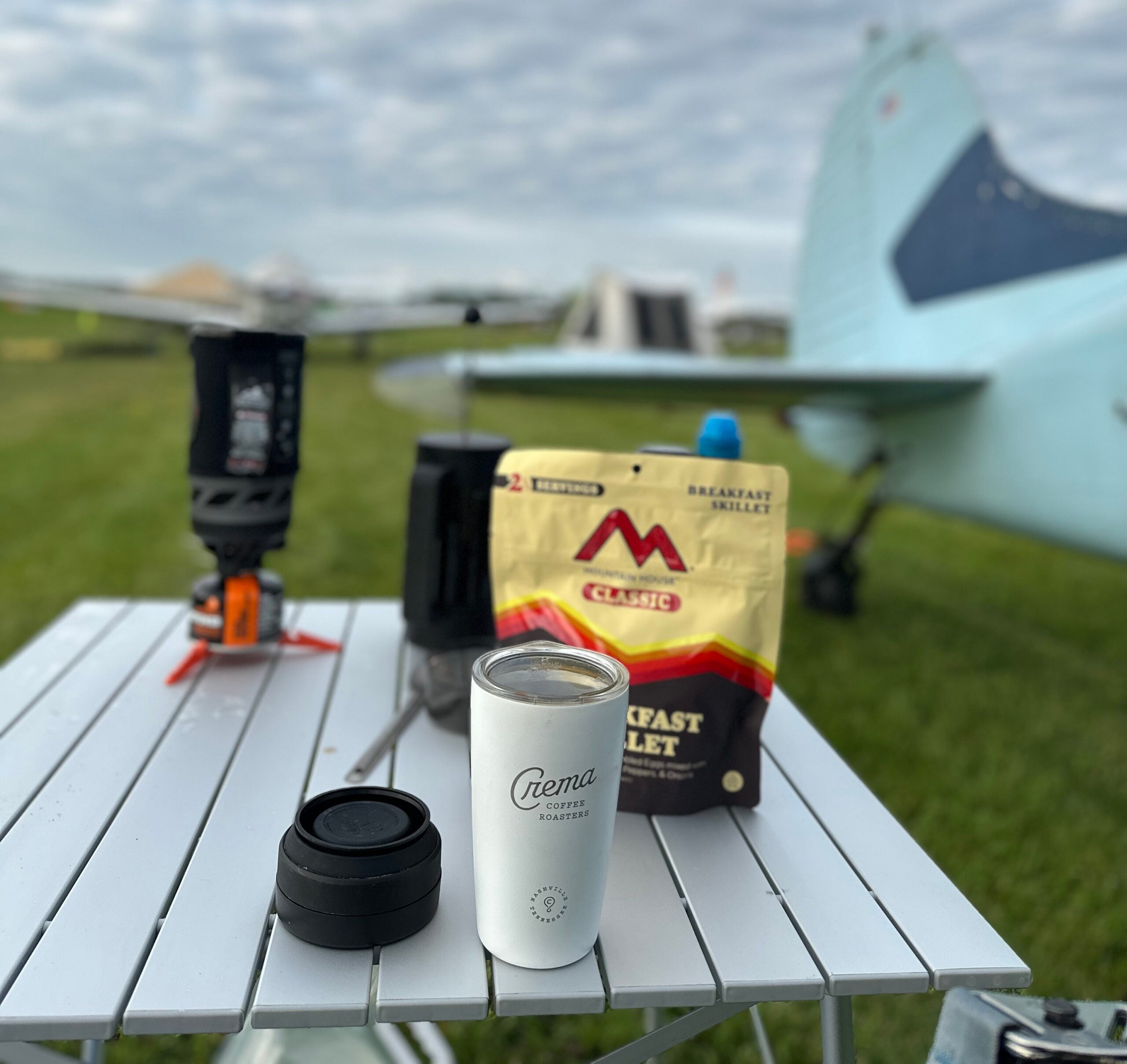 Camp table under a plane