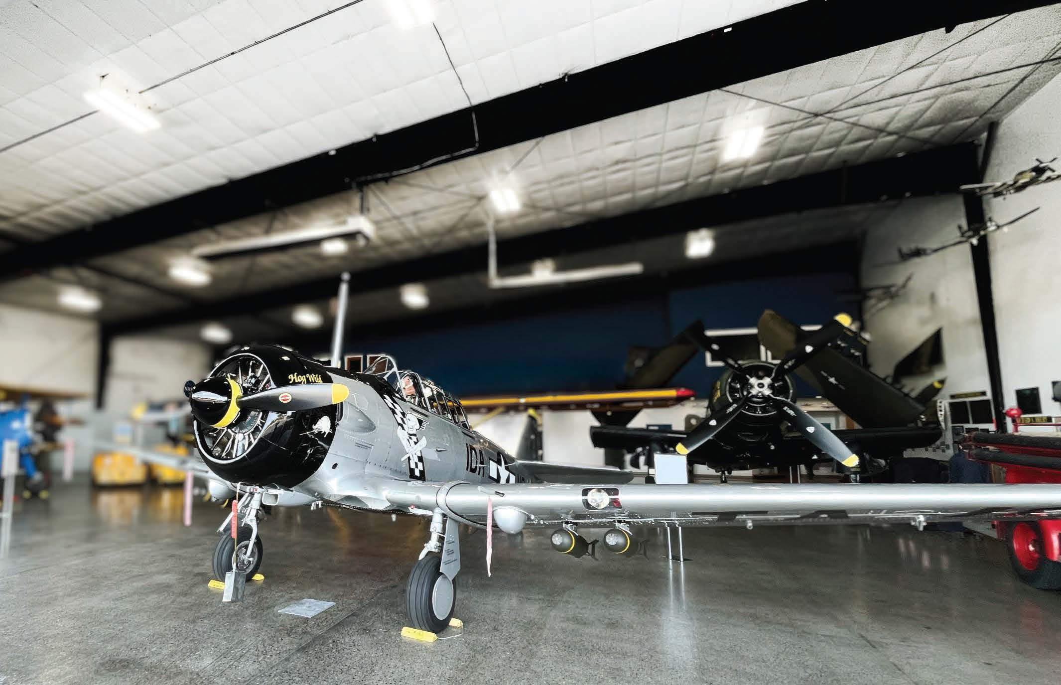 An open hangar door at the Heritage Flight Museum reveals a T6D Texan, Hog Wild Gunner. [Credit: Meg Godlewski]