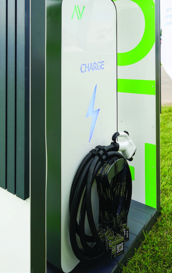 An 800-volt charger is used, but charge time varies with environmental conditions and charger performance.
The motor management computer (MMC) is above the power management computer (PMC). [LEFT - Courtesy: Jim Koepnick; RIGHT-- Courtesy: Tamar Burton]