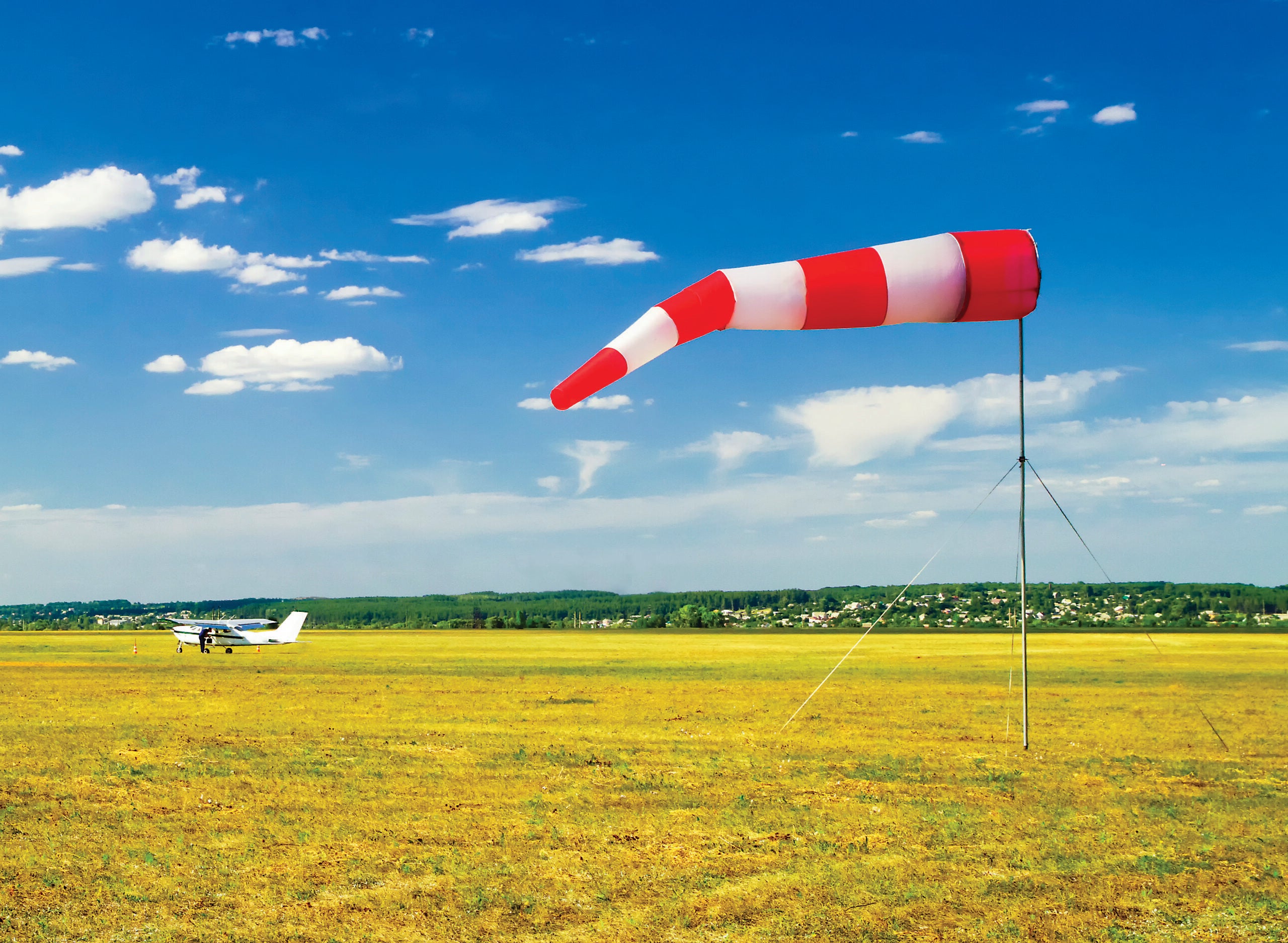 A red and white windsock. [Adobe Stock]